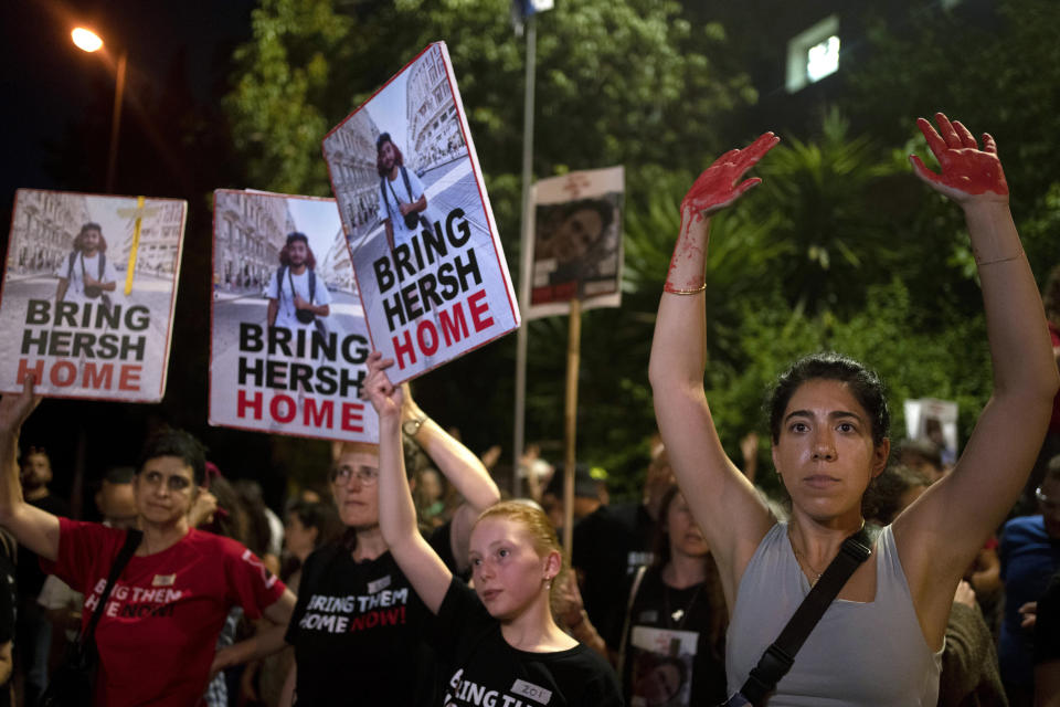 Friends and supporters of Israeli-American hostage Hersh Goldberg-Polin, who was kidnapped to the Gaza Strip on Oct. 7, 2023, protest outside of Israeli Prime Minister Benjamin Netanyahu's residence to demand a deal for the immediate release of all hostages, after Hamas released a video of Goldberg-Polin, in Jerusalem, Wednesday, April 24, 2024. (AP Photo/Maya Alleruzzo)