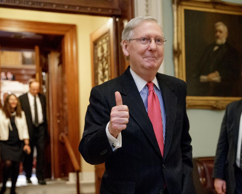 Senate Majority Leader Mitch McConnell of Ky. signals a thumbs-up as he leaves the Senate chamber on Capitol Hill in Washington, Thursday, April 6, 2017, after he led the GOP majority to change Senate rules and lower the vote threshold for Supreme Court nominees from 60 votes to a simple majority in order to advance Neil Gorsuch to a confirmation vote.