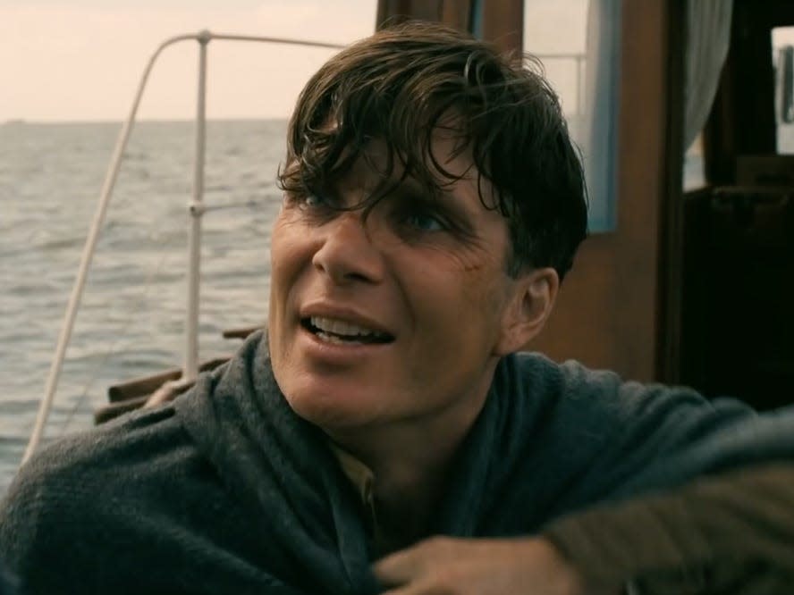 Cillian Murphy in a scene from "Dunkirk" where the Shivering Soldier is speaking on board a ship while wrapped in a blanket.