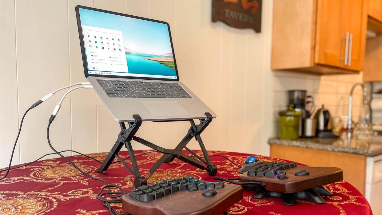  Nexstand Laptop Stand on a desk holding a laptop up. 