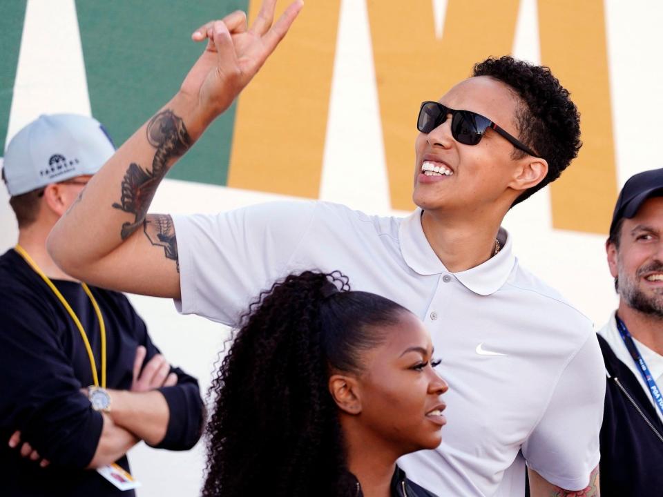 Brittney Griner waves to the crowd at the 2023 Waste Management Phoenix Open.