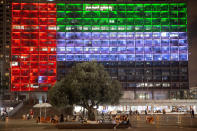 Tel Aviv City Hall is lit up with the flags of the United Arab Emirates and Israel as the countries announced they would be establishing full diplomatic ties, in Tel Aviv, Israel, Thursday, Aug. 13, 2020. In a nationally broadcast statement, Prime Minister Benjamin Netanyahu said the "full and official peace" with the UAE would lead to cooperation in many spheres between the countries and a "wonderful future" for citizens of both countries. (AP Photo/Oded Balilty)