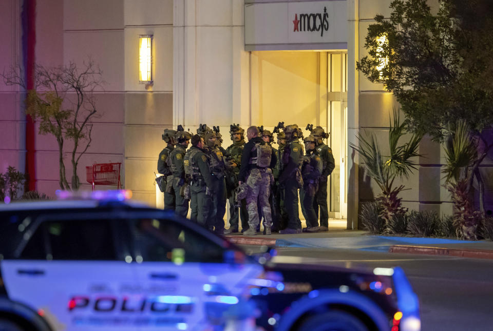 Police officers gather at an entrance of a shopping mall, Wednesday, Feb. 15, 2023, in El Paso, Texas. Police say one person was killed and three other people were wounded in a shooting at Cielo Vista Mall. One person has been taken into custody, El Paso police spokesperson Sgt. Robert Gomez said. (AP Photo/Andrés Leighton)