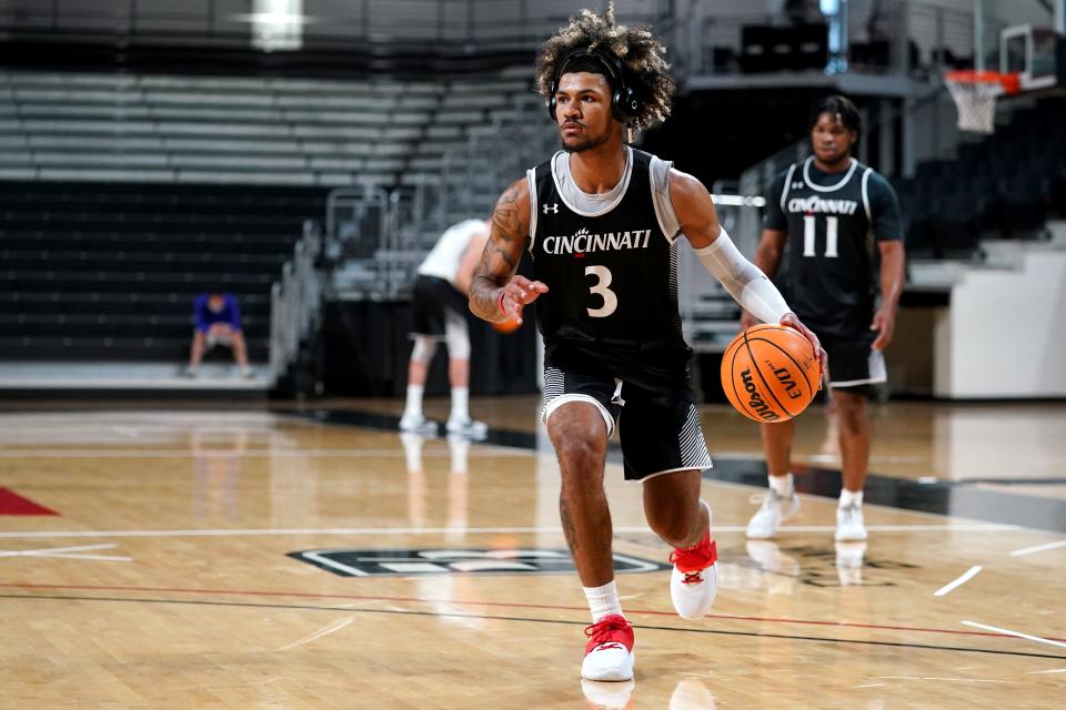 Cincinnati Bearcats guard Mike Saunders Jr. dribbles during practice, Monday, Oct. 4, 2021, at Fifth Third Arena in Cincinnati.