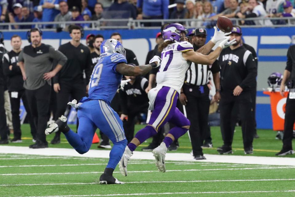 Lions cornerback Jerry Jacobs defends against Vikings tight end T.J. Hockenson during the first half of the Lions' 34-23 win over the Vikings on Sunday, Dec. 11, 2022, at Ford Field.