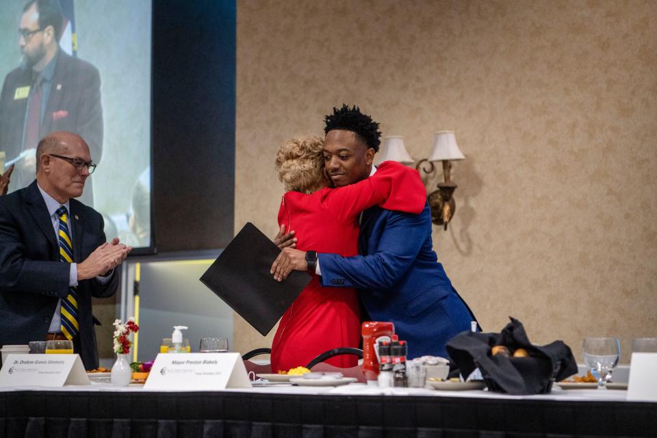 Oralene Simmons, MLK Association founder and president, hugs her grandson, Fletcher Mayor Preston Blakely, after his keynote speech at the 42nd annual Martin Luther King Jr. Prayer Breakfast at the Crowne Plaza in Asheville January 14, 2023.