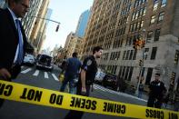 Police cordon off the scene in lower Manhattan where two people were shot at the Federal Immigration Court on August 21, 2015 in New York City