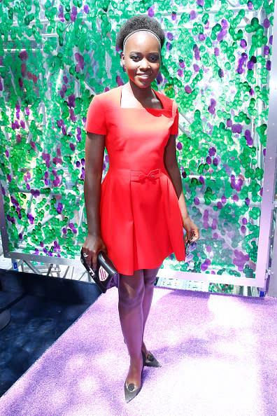 <p>Lupita Nyong'o was as sweet as ever in a red tailored dress.</p>