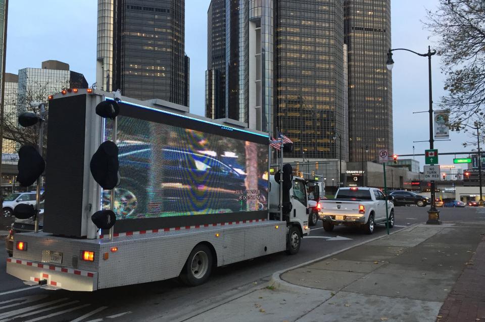 Surveillance video paid for by Detroit businessman Robert Carmack, plays on a screen near the Renaissance Center in Detroit on Nov. 14, 2018.