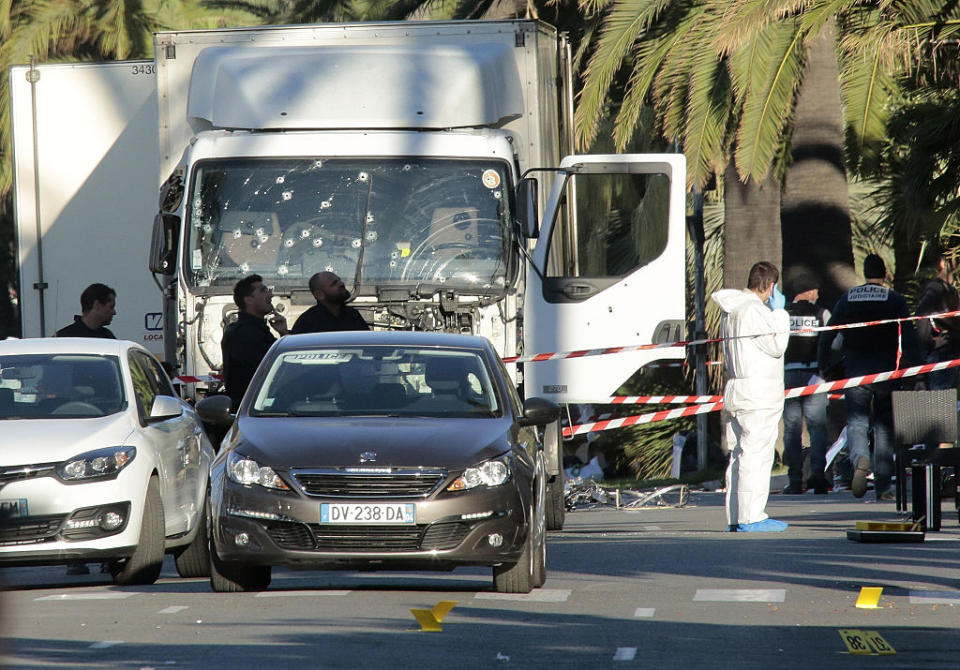 The police look for evidence after a truck ramming incident