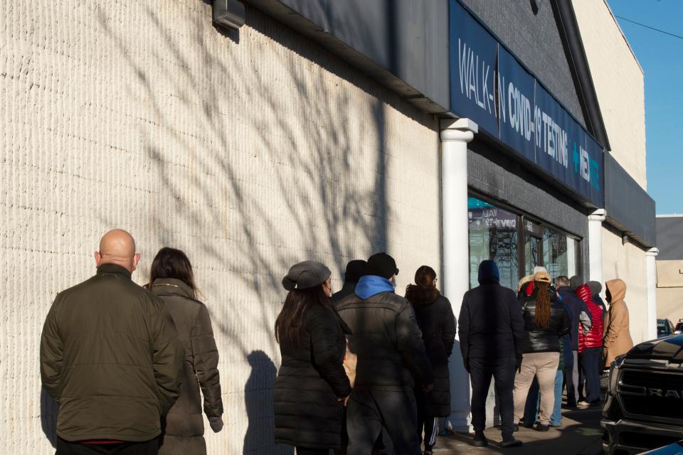 People lined up around the building for COVID-19 tests at the MedRite Urgent Care clinic at the Route 17 location in Paramus, N.J. on Monday Dec. 20, 2021. 