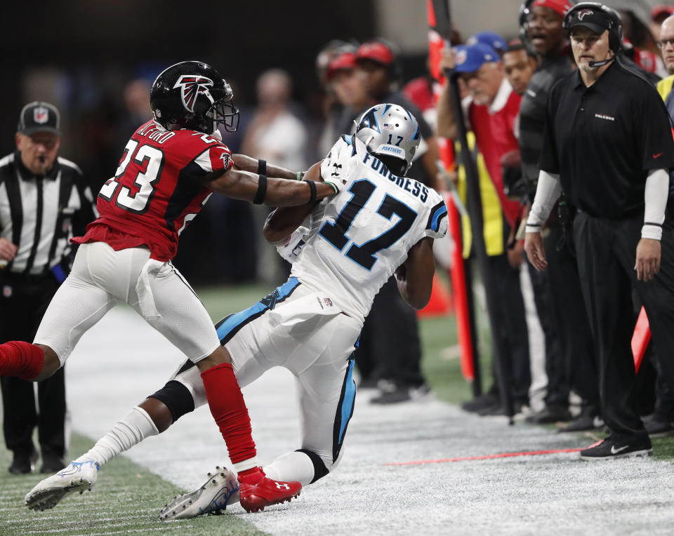 Carolina Panthers wide receiver Devin Funchess (17) makes the catch against Atlanta Falcons defensive back Robert Alford (23) during the second half of an NFL football game, Sunday, Sept. 16, 2018, in Atlanta. The Atlanta Falcons won 31-24. (AP Photo/John Bazemore)