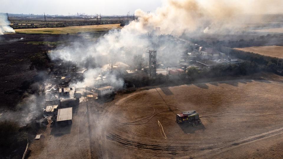 Smoke rises from the fires being fought by emergency services seen in Wennington, east London (Getty Images)