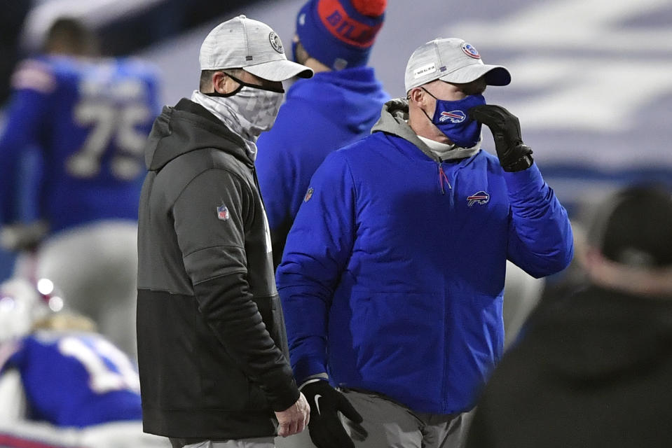 Baltimore Ravens head coach John Harbaugh, left, talks to Buffalo Bills head coach Sean McDermott before an NFL divisional round football game Saturday, Jan. 16, 2021, in Orchard Park, N.Y. (AP Photo/Adrian Kraus)