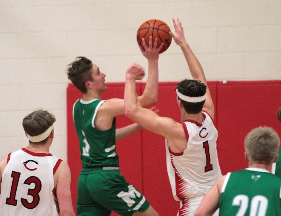 Mendon's Noah Roberts puts up a shot against Colon on Friday night.