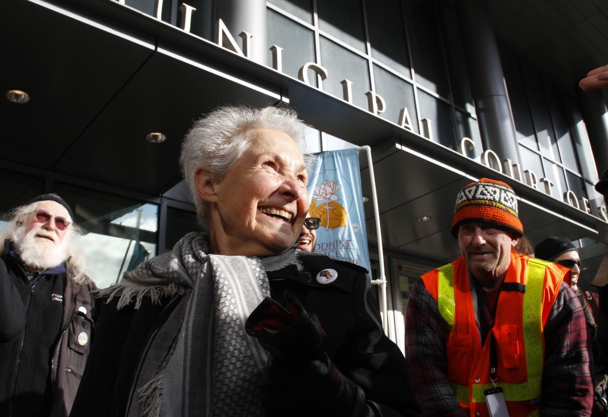 Dorli Rainey, who was pepper-sprayed by police while taking part in an "Occupy Seattle" protest, smiles before speaking on Nov. 18, 2011, in front of police headquarters in Seattle.