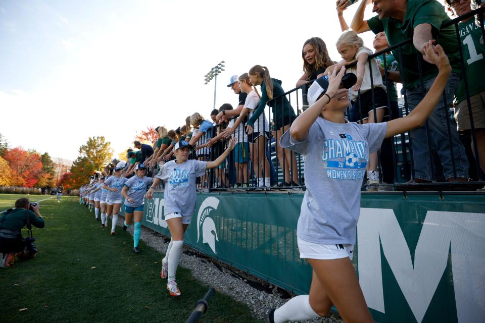 Michigan State players greet fans after defeating Rutgers, Sunday, Oct. 23, 2022, in East Lansing.