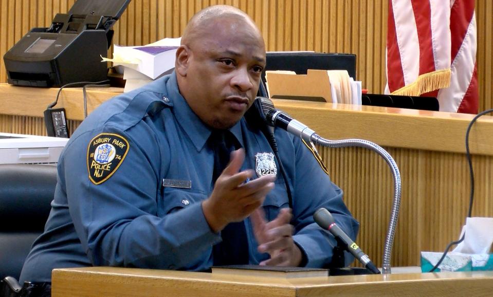 Asbury Park Police officer Jesse Kendle testifies about being first on the scene and discovering Denzel Morgan-Hicks in the front seat of a car obviously deceased.   Avery Hopes and Vernon Sanders are on trial for the killing before Superior Court Judge Jill O'Malley at the Monmouth County Courthouse Thursday, February 9, 2023.  