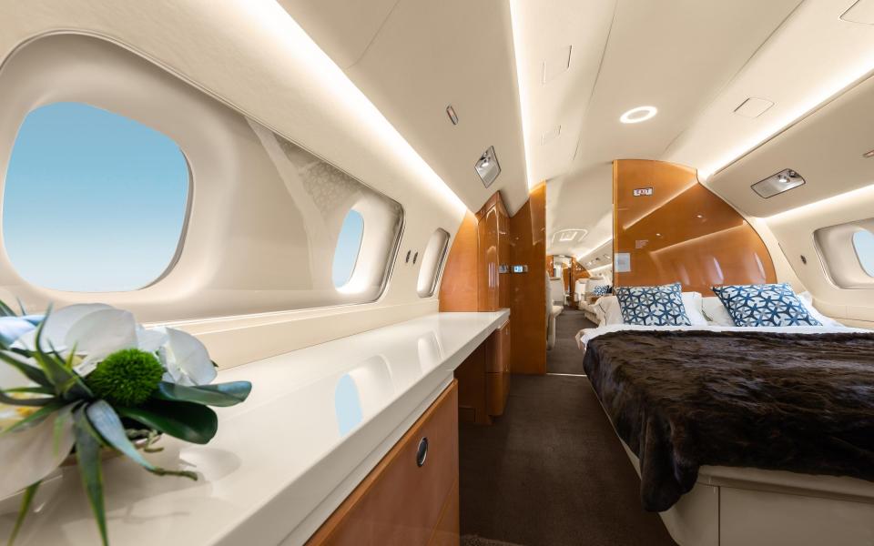 A bedroom on a Lineage 1000 private jet by Embraer - Helmut Harringer