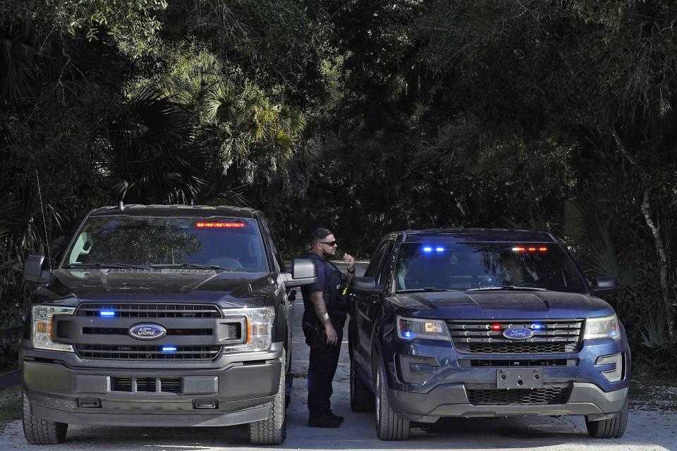 North Port, Fla., police officers block the entrance to the Myakkahatchee Creek Environmental Park Wednesday, Oct. 20, 2021, in North Port, Fla.