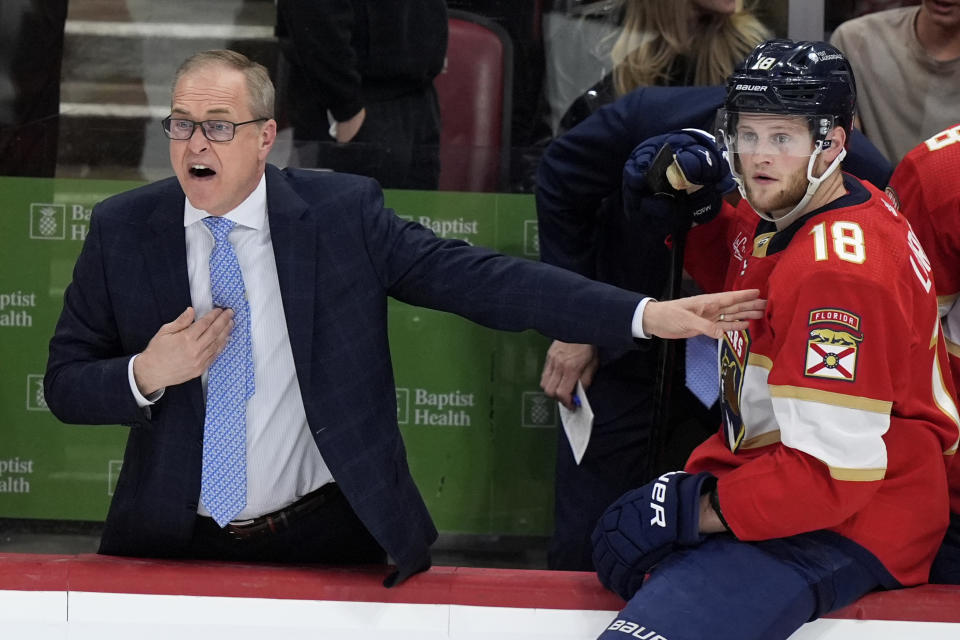 Florida Panthers coach Paul Maurice reacts during the third period of Game 2 against the Boston Bruins in a second-round series of the NHL hockey Stanley Cup playoffs Wednesday, May 8, 2024, in Sunrise, Fla. At right is center Steven Lorentz (18). (AP Photo/Lynne Sladky)