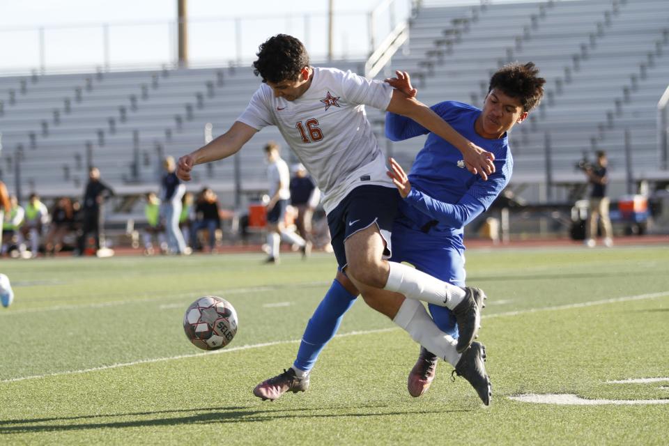 Riverside High School's Cristian Rosales fights for the ball against San Elizario's Eduardo Marquez during the Class 4A regional quarterfinals playoff game at Del Valle High school on Friday. The Eagles won, 2-0, to advance to the Region 1-4A semifinals.