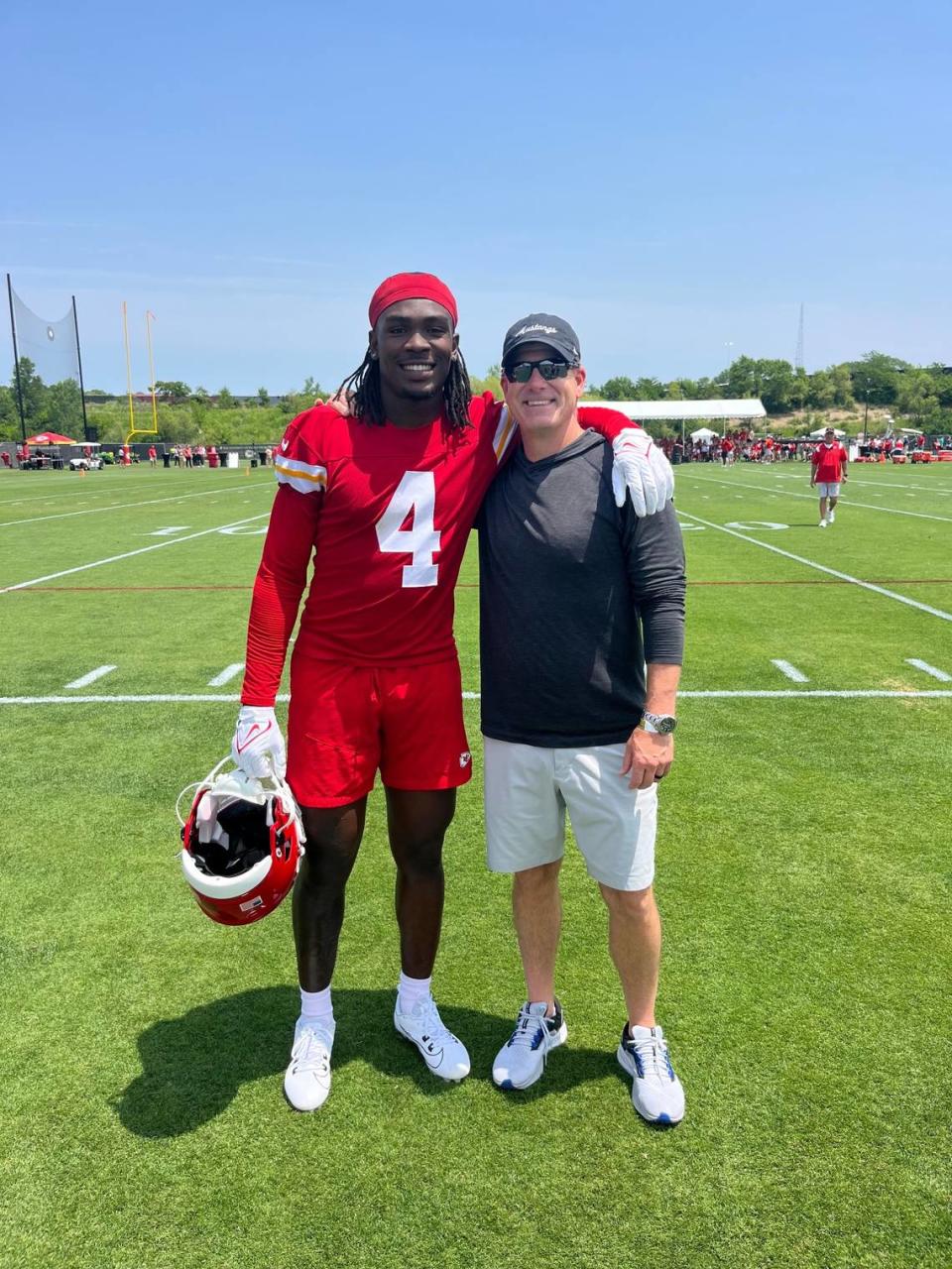 Chiefs receiver Rashee Rice, left, poses with SMU receivers coach Rob Likens during an OTAs practice in spring 2023.