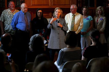 U.S. presidential candidate Hillary Clinton (C) speaks to supporters at a campaign event in Mason City, Iowa, United States, May 18, 2015. REUTERS/Jim Young