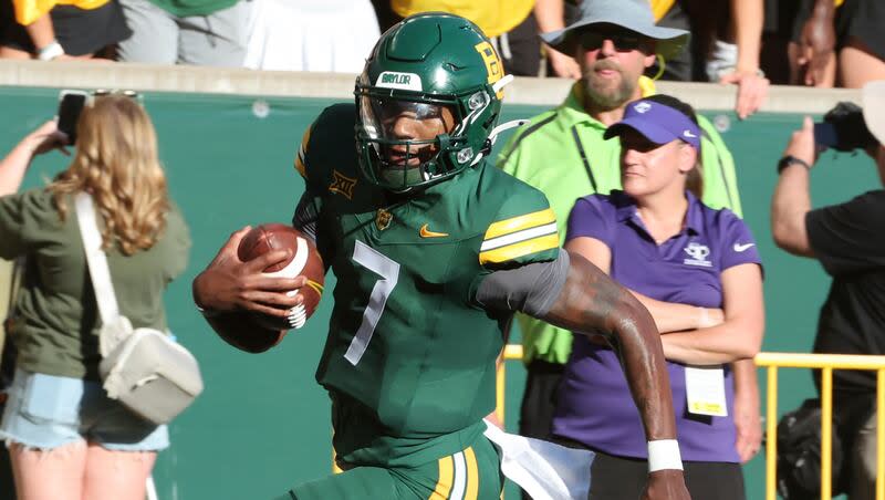 Baylor quarterback Dequan Finn scores against Tarleton State on an end around play in the first half of an college football game, Saturday, Aug. 31, 2024, in Waco, Texas.