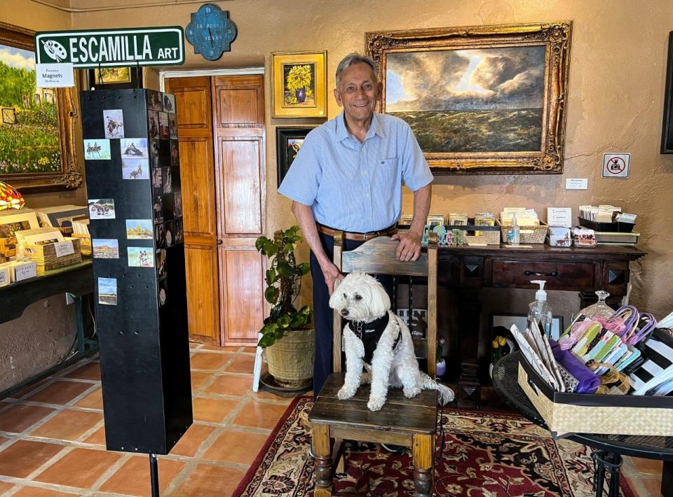 Artist Alberto Escamilla found his dog Monet 13 years ago, the same amount of time he has had a fine art gallery in San Elizario at 1445 Main St., Suite B1.