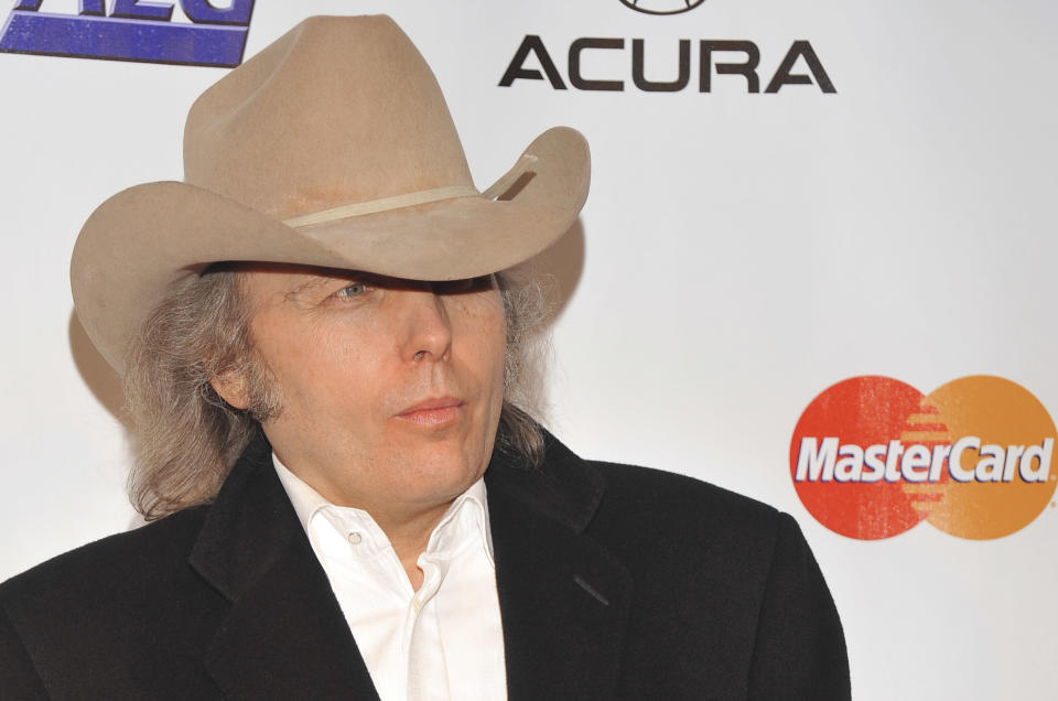 FILE - This Jan. 29, 2010 file photo shows country singer Dwight Yoakam arriving at the MusiCares Person of the Year tribute honoring Neil Young in Los Angeles. Yoakam's first album in his return to Warner Bros. Records comes out Sept. 18, 2012. (AP Photos/Vince Bucci, file)