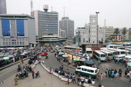 People move on a street of Marina in Victoria Island, Lagos, Nigeria February 15, 2019. REUTERS/Temilade Adelaja