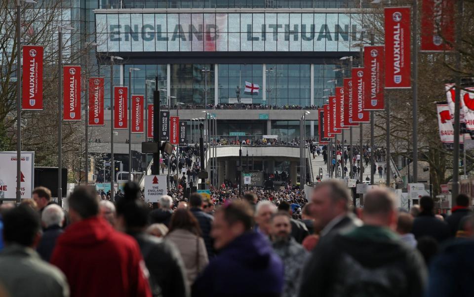 England fans make their way to Wembley - Credit: PA