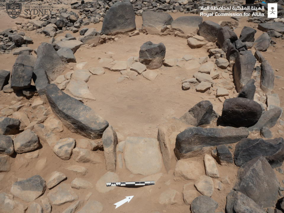 A circle of stones in a dusty landscape