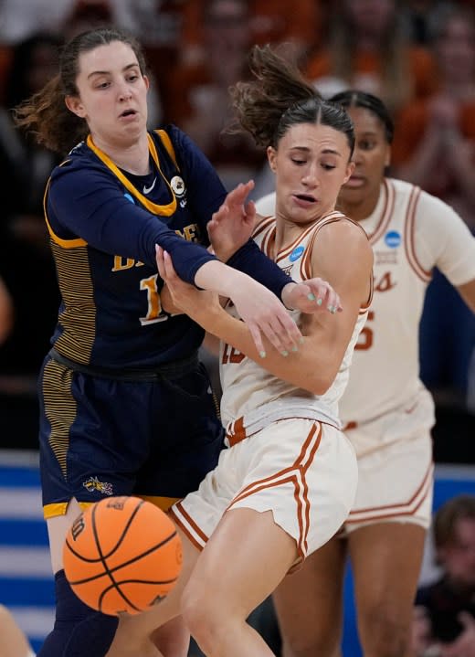 Drexel guard Erin Sweeney (13) and Texas guard Shay Holle (10) battle for control of the ball during the first half of a first-round college basketball game in the women’s NCAA Tournament in Austin, Texas, Friday, March 22, 2024. (AP Photo/Eric Gay)