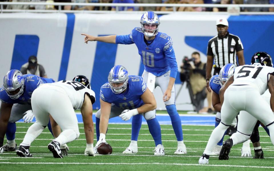 Detroit Lions quarterback Nate Sudfeld runs the offense with Alex Mollette at center against the Jacksonville Jaguars during the second half of a preseason game at Ford Field, Saturday, August 19, 2023.