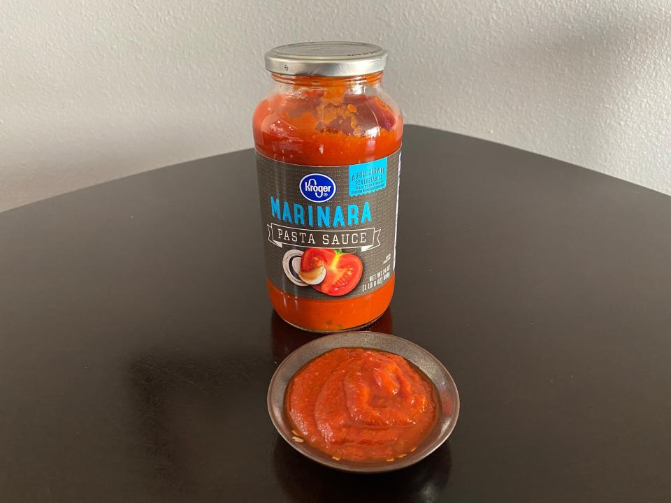 kroger marinara sauce with a small dish of the sauce in front of it