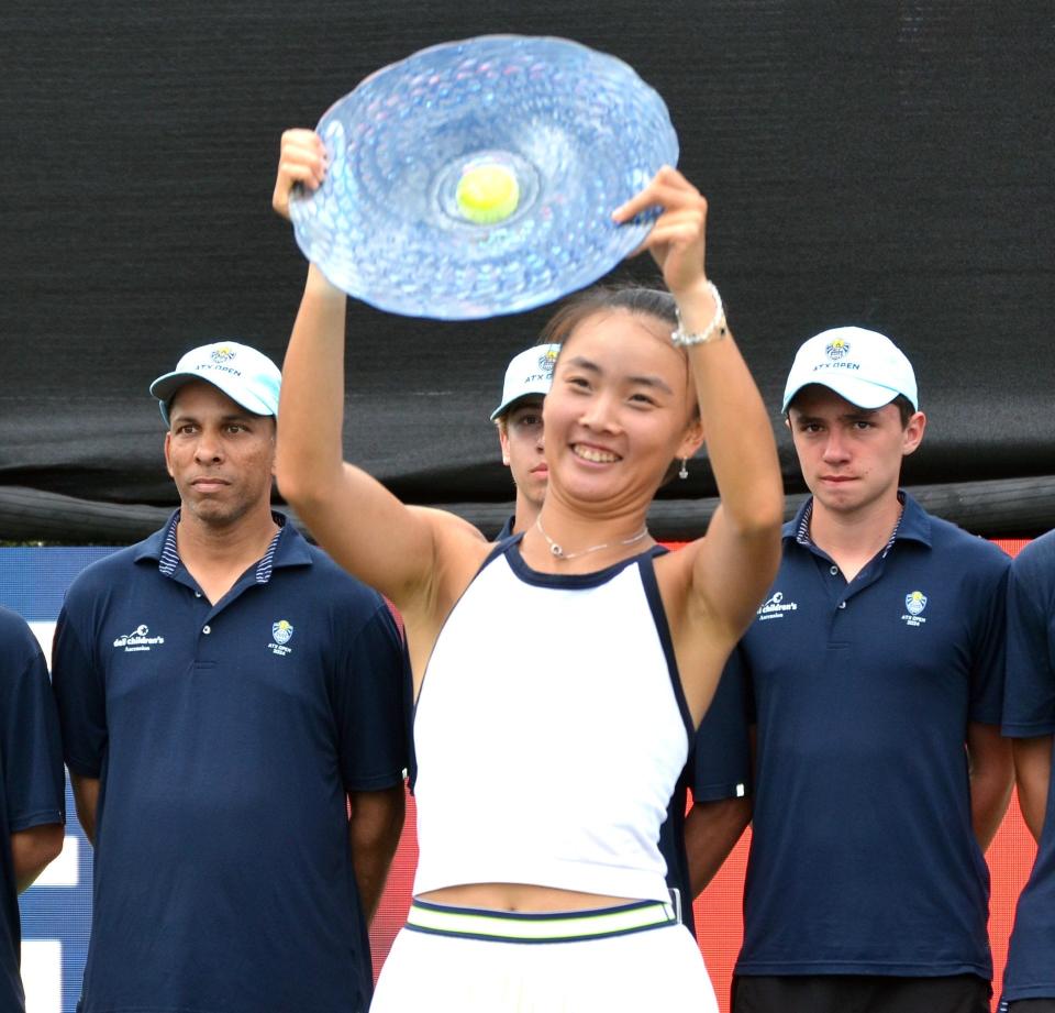 Yue Yuan holds the ATX Open championship trophy after beating Xiyu Wang 6-4, 7-6 (7-4) in Sunday's singles final at Westwood Country Club. It was the first WTA final held in the United States to match two players from China.