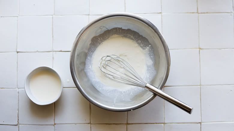 Whisking crème fraîche and cream