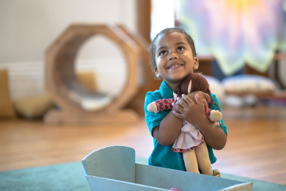 Child Playing with Doll 