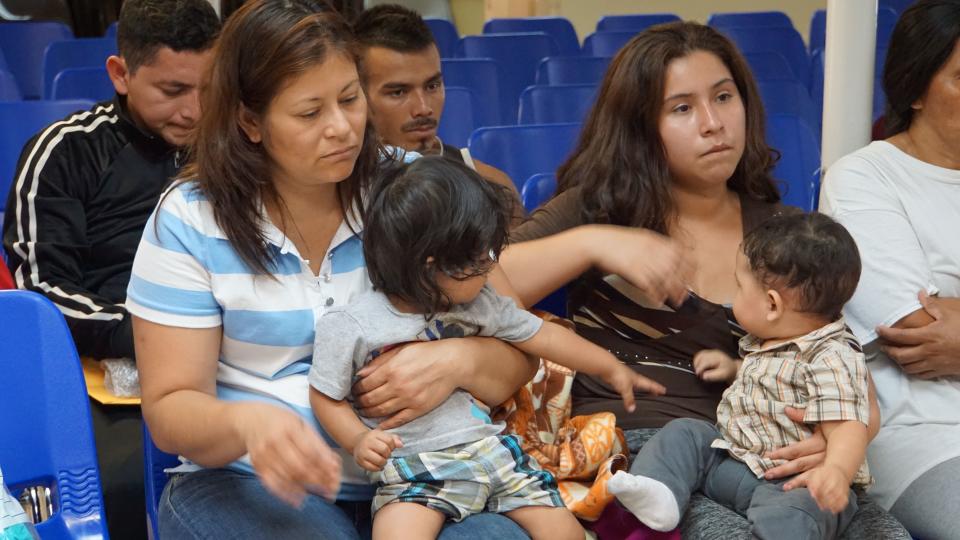 Mothers and children wait to be assisted by volunteers in a humanitarian center in the border town of McAllen, Texas, on June 14, 2018. (Photo: LEILA MACOR via Getty Images)