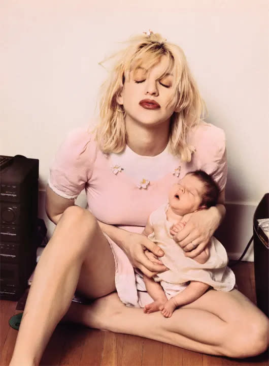 Courtney Love carrying Francis Bean as a baby