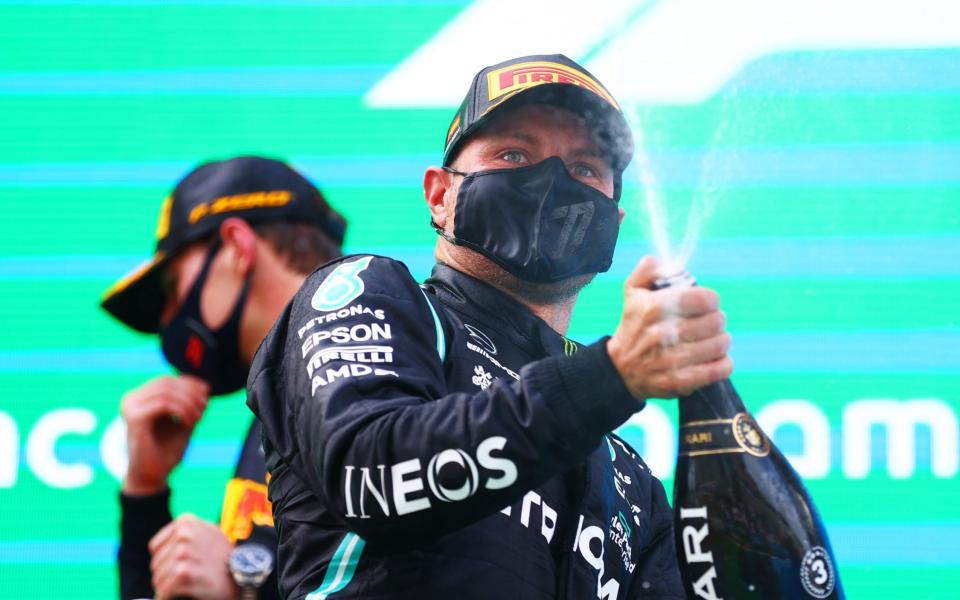 Valtteri Bottas of Finland and Mercedes AMG Petronas celebrates on the podium after finishing third during the F1 Grand Prix of Spain at Circuit de Barcelona-Catalunya on May 09, 2021 in Barcelona, Spain - formula 1/Formula 1 via Getty Images