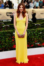 <p>Hannah Murray’s red hair juxtaposed well with a bright yellow column gown. <i>Photo: Getty Images</i></p>
