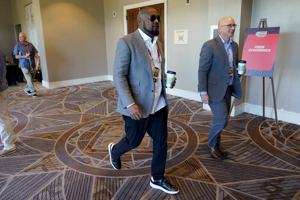 Pittsburgh Steelers head coach Mike Tomlin leaves the AFC head coaches availability at the NFL meetings, Monday, March 27, 2023, in Phoenix. (AP Photo/Matt York)