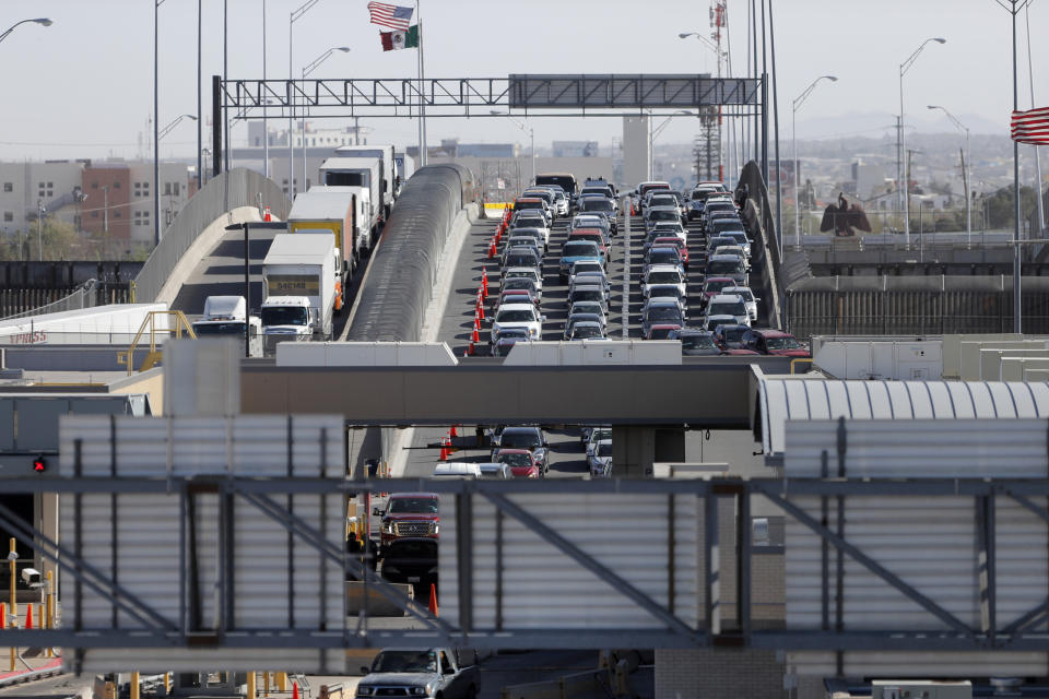 FILE - In this March 29, 2019, file photo, cars and trucks line up to enter the U.S. from Mexico at a border crossing in El Paso, Texas. Authorities in far South Texas say U.S. Border Patrol agents have discovered the bodies of four people, including three children, who appeared to have died from heat exposure after crossing the Rio Grande. Hidalgo County sheriff's Sgt. Frank Medrano said the bodies of a woman in her early 20s, a toddler and two infants were found Sunday, June, 23, 2019, in or near Anzalduas Park, which borders the river in the city of Mission. (AP Photo/Gerald Herbert, File)