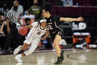 Texas A&M guard Aaliyah Wilson (2) drives the lane against South Carolina guard Brea Beal (12) during the first half of an NCAA college basketball game Sunday, Feb. 28, 2021, in College Station, Texas. (AP Photo/Sam Craft)
