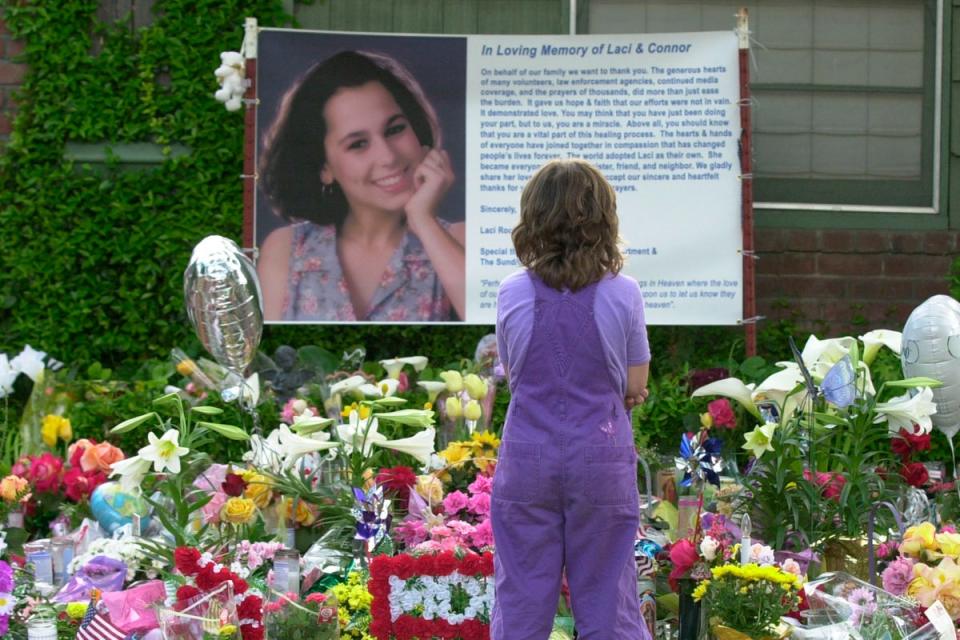 In this file shot, a mourner stands in front of a memorial to Laci Peterson in 2003 (Associated Press)