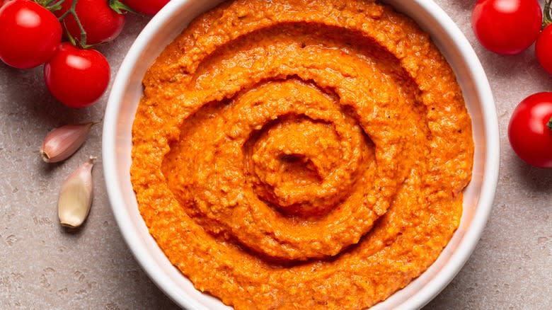 Bowl of romesco with tomatoes and garlic