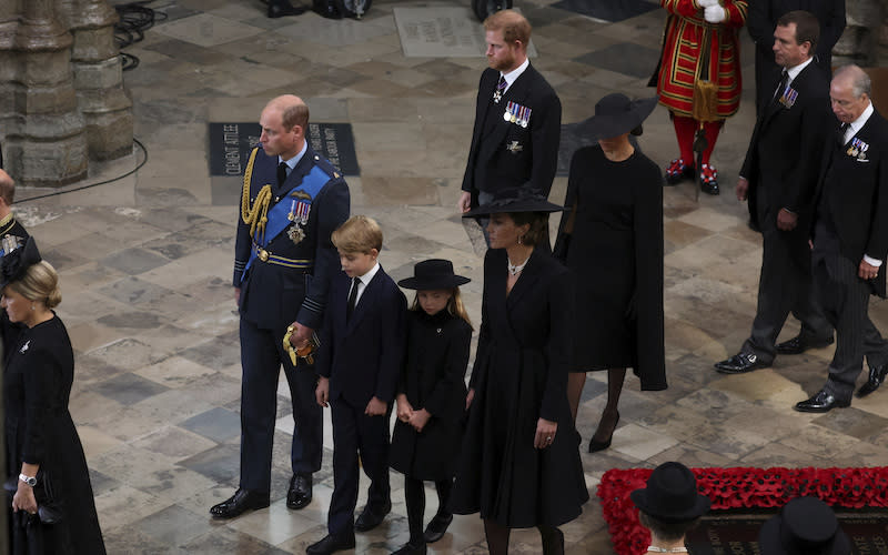 Britain’s Prince William, Kate, Princess of Wales, Prince Harry, Meghan, Duchess of Sussex, Prince George and Princess Charlotte at the Westminster Abbey.